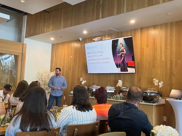 Rob presenting about AI for business in The Woodlands, Texas at the local Table restaurant in front of a group of business owners.